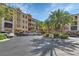 Condo building with parking and tropical landscaping at 98 Vivante Blvd # 98412, Punta Gorda, FL 33950