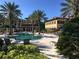 Community pool with lounge chairs and building views at 98 Vivante Blvd # 98412, Punta Gorda, FL 33950