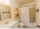 Clean bathroom with white vanity and beige tile floor at 9209 Seminole Blvd # 117, Seminole, FL 33772