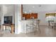 View of kitchen with ample wood cabinetry, stainless steel appliances, a breakfast bar and dining area at 1712 Lastingham Ln, Port Charlotte, FL 33980