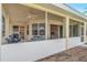 Relaxing screened porch with ceiling fan, offering additional living space at 1871 Mossy Oak Dr, North Port, FL 34287