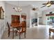 Dining room with a wooden table, chairs, and a view to the kitchen at 1712 Lastingham Ln, Port Charlotte, FL 33980