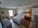 Bedroom featuring neutral walls, ceiling fan, and coordinated furniture set at 21427 Michigan Ave, Port Charlotte, FL 33952