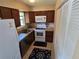 Compact kitchen featuring updated appliances and countertops at 21427 Michigan Ave, Port Charlotte, FL 33952