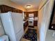 Kitchen featuring white appliances, wood cabinets, granite counters and tile flooring at 21427 Michigan Ave, Port Charlotte, FL 33952
