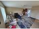 Spacious living room featuring neutral walls, ceiling fan, comfortable seating and a patterned area rug at 21427 Michigan Ave, Port Charlotte, FL 33952