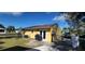 Backyard view of house with grill and fenced-in area at 21427 Michigan Ave, Port Charlotte, FL 33952