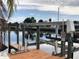 Private boat lift with dock access, perfect for enjoying waterfront living at 21277 Edgewater Dr, Port Charlotte, FL 33952