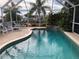 Screened pool and patio area with waterfall at 21277 Edgewater Dr, Port Charlotte, FL 33952
