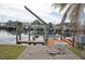 Private boat lift with dock and waterfront access at 21277 Edgewater Dr, Port Charlotte, FL 33952
