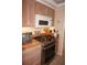 Gas range, microwave, and built-in oven featured in this kitchen at 21277 Edgewater Dr, Port Charlotte, FL 33952