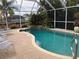 Relaxing screened pool area with waterfall feature at 21277 Edgewater Dr, Port Charlotte, FL 33952