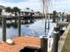 Wooden dock with chairs and waterfront access at 21277 Edgewater Dr, Port Charlotte, FL 33952