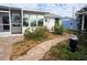 Landscaped backyard with brick pavers and walkway at 21277 Edgewater Dr, Port Charlotte, FL 33952