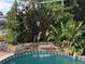 Relaxing waterfall feature next to the pool at 21277 Edgewater Dr, Port Charlotte, FL 33952