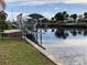 Relaxing view of the canal with boat lift and lush landscaping at 21277 Edgewater Dr, Port Charlotte, FL 33952