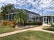 Relaxing pool area with screened enclosure and lush landscaping at 21277 Edgewater Dr, Port Charlotte, FL 33952