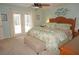 Main bedroom with king-size bed and access to the pool at 21277 Edgewater Dr, Port Charlotte, FL 33952