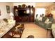 Elegant living room with a large TV, comfortable seating, and a view to dining area at 21277 Edgewater Dr, Port Charlotte, FL 33952