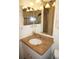 Bathroom with granite vanity and a large mirror at 21277 Edgewater Dr, Port Charlotte, FL 33952