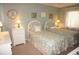 Bedroom with twin beds, white dresser, and coastal decor at 21277 Edgewater Dr, Port Charlotte, FL 33952