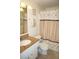 Bathroom with shower/tub combo, granite vanity, and seashell decor at 21277 Edgewater Dr, Port Charlotte, FL 33952