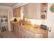 Updated kitchen with granite countertops and ample cabinet space at 21277 Edgewater Dr, Port Charlotte, FL 33952