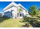 Back exterior with patio and grassy area at 22375 Edgewater Dr # 239, Port Charlotte, FL 33980