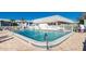 Relaxing community pool area with surrounding seating at 22375 Edgewater Dr # 239, Port Charlotte, FL 33980