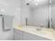 Clean bathroom with a large vanity mirror and tiled walls at 22375 Edgewater Dr # 239, Port Charlotte, FL 33980