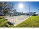 Relaxing community with shuffleboard courts and shaded seating areas at 22375 Edgewater Dr # 239, Port Charlotte, FL 33980