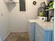 Laundry room with washer, dryer, and storage at 22312 Niagara Ave, Port Charlotte, FL 33952