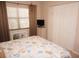 Bedroom with a queen-size bed, window with blinds, and a large closet at 175 Kings Hwy # 411, Punta Gorda, FL 33983