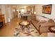 Open living and dining area with light wood floors and neutral decor at 175 Kings Hwy # 411, Punta Gorda, FL 33983