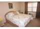 Bedroom with a queen-size bed and beach-themed bedding at 175 Kings Hwy # 411, Punta Gorda, FL 33983