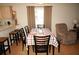 Dining area with a table for six and a view of the kitchen at 175 Kings Hwy # 411, Punta Gorda, FL 33983