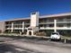 Two-story condo building with parking and a landscaped area at 175 Kings Hwy # 411, Punta Gorda, FL 33983