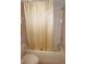 Bathroom with a shower/tub combo and beige tile flooring at 175 Kings Hwy # 411, Punta Gorda, FL 33983
