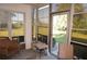 Sunroom with wicker furniture and access to the outdoors at 175 Kings Hwy # 411, Punta Gorda, FL 33983