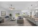 Open living room featuring hardwood floors, and access to backyard at 825 Haleybury St, Port Charlotte, FL 33948