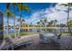 Waterfront patio with seating area, offering peaceful water views at 3705 Toulouse Ct, Punta Gorda, FL 33950