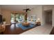 Living room with tile flooring, comfy seating and pool view at 21445 Peachland Blvd, Port Charlotte, FL 33954