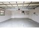 Spacious garage with overhead storage and extra space at 21445 Peachland Blvd, Port Charlotte, FL 33954