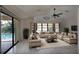 Living room with beige furniture and pool access at 21445 Peachland Blvd, Port Charlotte, FL 33954