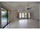 Spacious living room with tile floors and pool view at 21445 Peachland Blvd, Port Charlotte, FL 33954