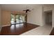 Living room with tile floor, sliding doors to pool, ceiling fan at 21445 Peachland Blvd, Port Charlotte, FL 33954