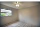 Bright bedroom with tile floors and a window at 21445 Peachland Blvd, Port Charlotte, FL 33954