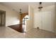 Bright and spacious entryway with tile flooring, double doors, and arched window at 21445 Peachland Blvd, Port Charlotte, FL 33954