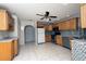 Kitchen with wood cabinets and tile flooring at 21445 Peachland Blvd, Port Charlotte, FL 33954