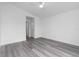 Bedroom featuring a ceiling fan, vinyl flooring, and white walls at 23359 Mcmanaway Ave, Port Charlotte, FL 33980